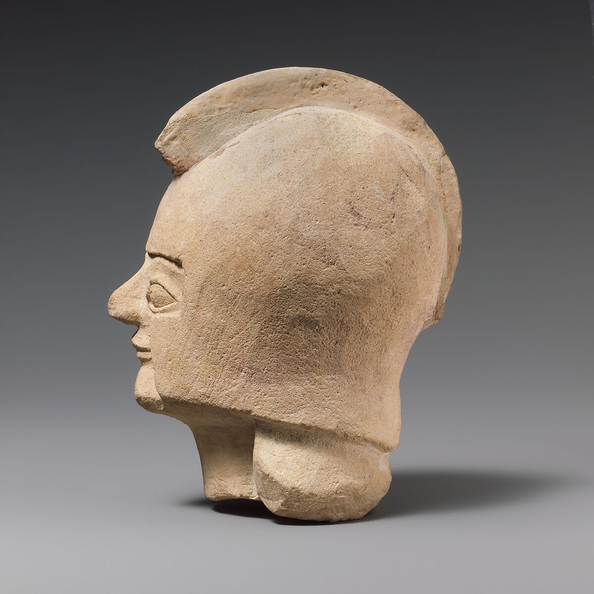 Limestone head of a warrior wearing a crested helmet, Limestone, Cypriot