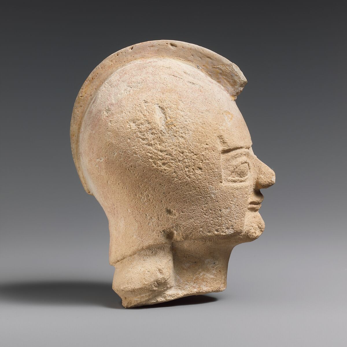 Limestone head of a warrior wearing a crested helmet, Limestone, Cypriot