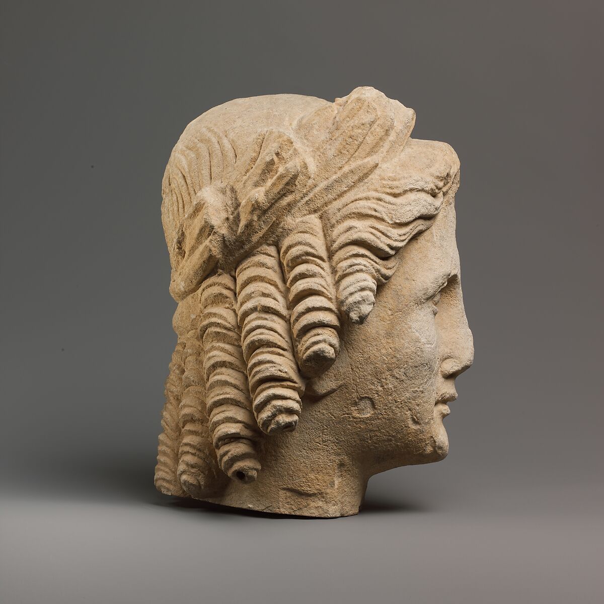 Limestone head of Apollo, Limestone, Cypriot