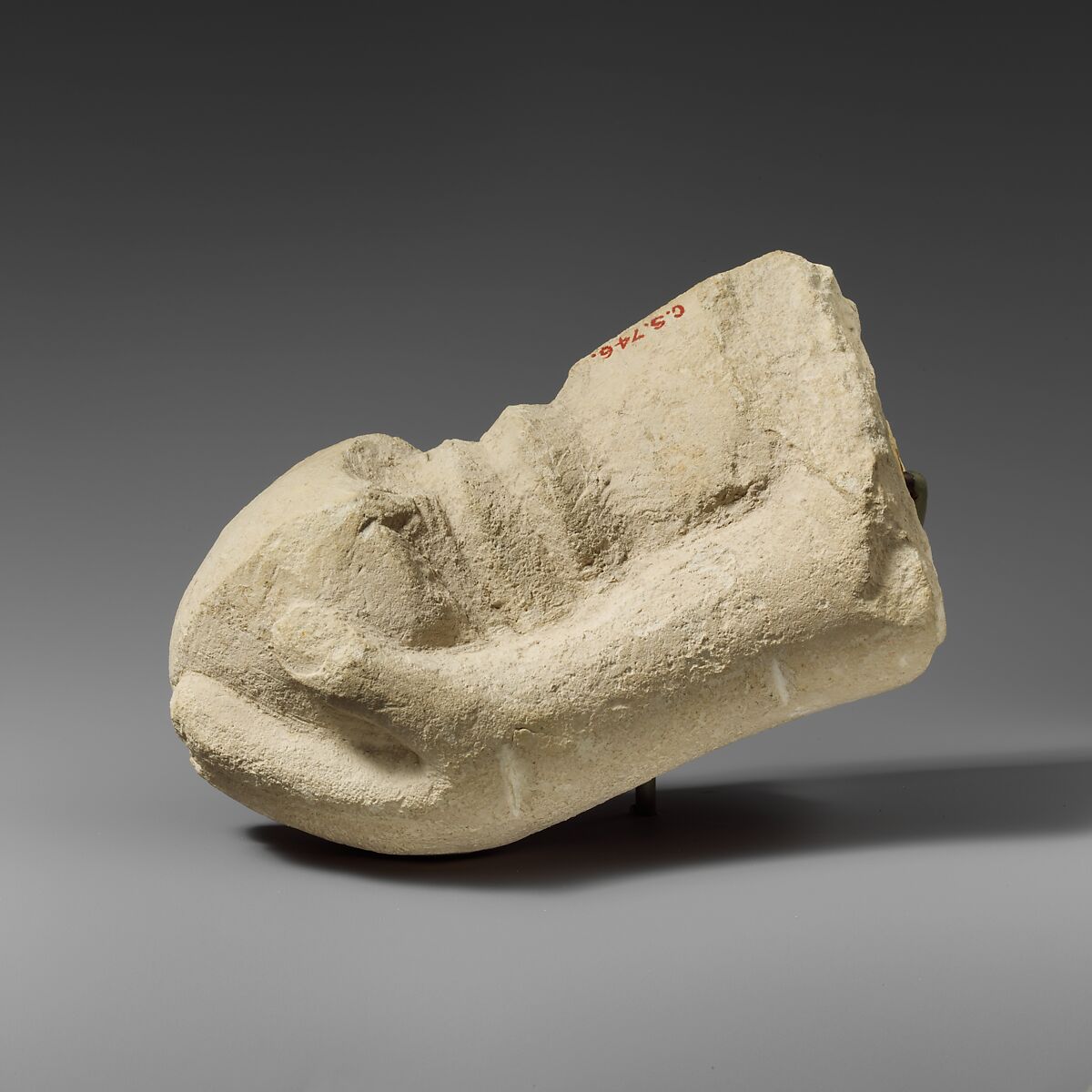 Limestone hand holding a sword (?), Limestone, Cypriot 