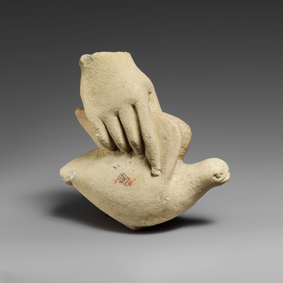 Limestone hand holding a dove, Limestone, Cypriot 