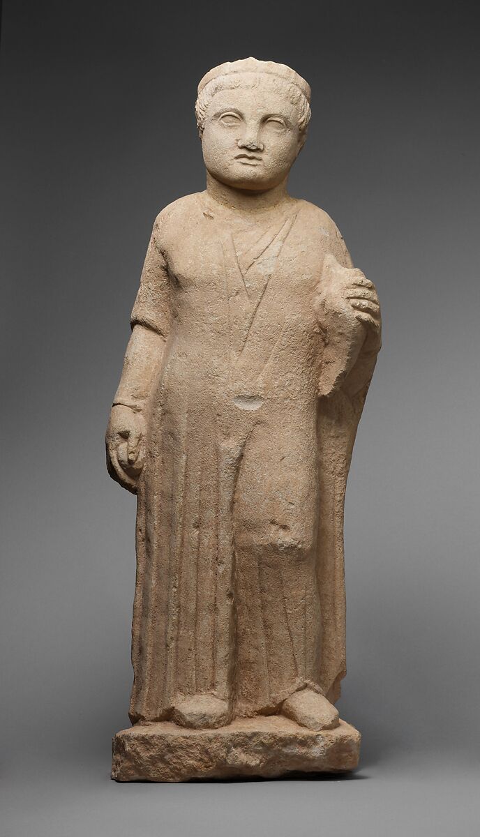 Limestone statue of a male votary holding a dove and an apple, Limestone, Cypriot 