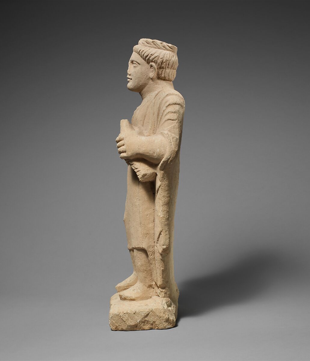 Limestone statuette of a boy with a wreath of leaves, Limestone, Cypriot
