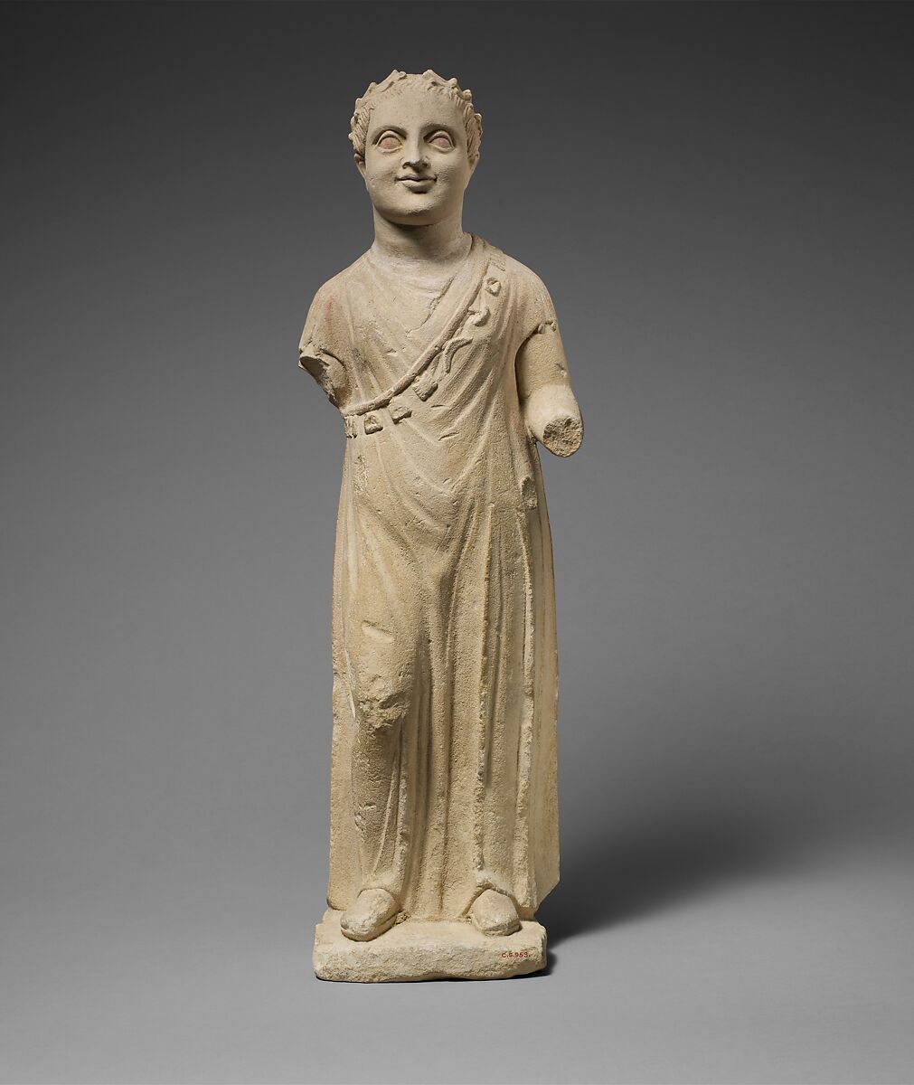 Limestone statuette of a boy with a chain of amulets, Limestone, Cypriot 