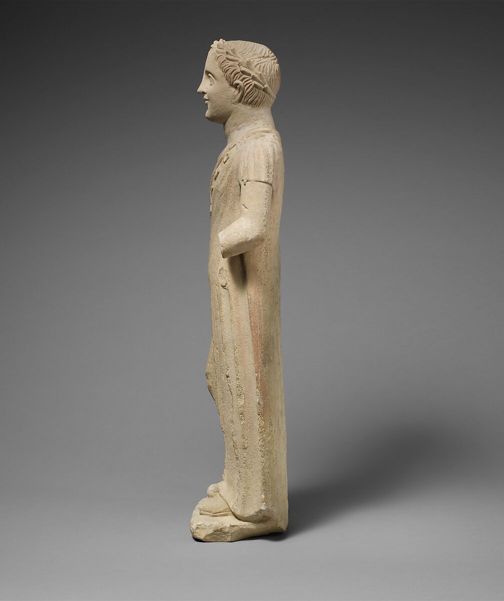 Limestone statuette of a boy with a chain of amulets, Limestone, Cypriot