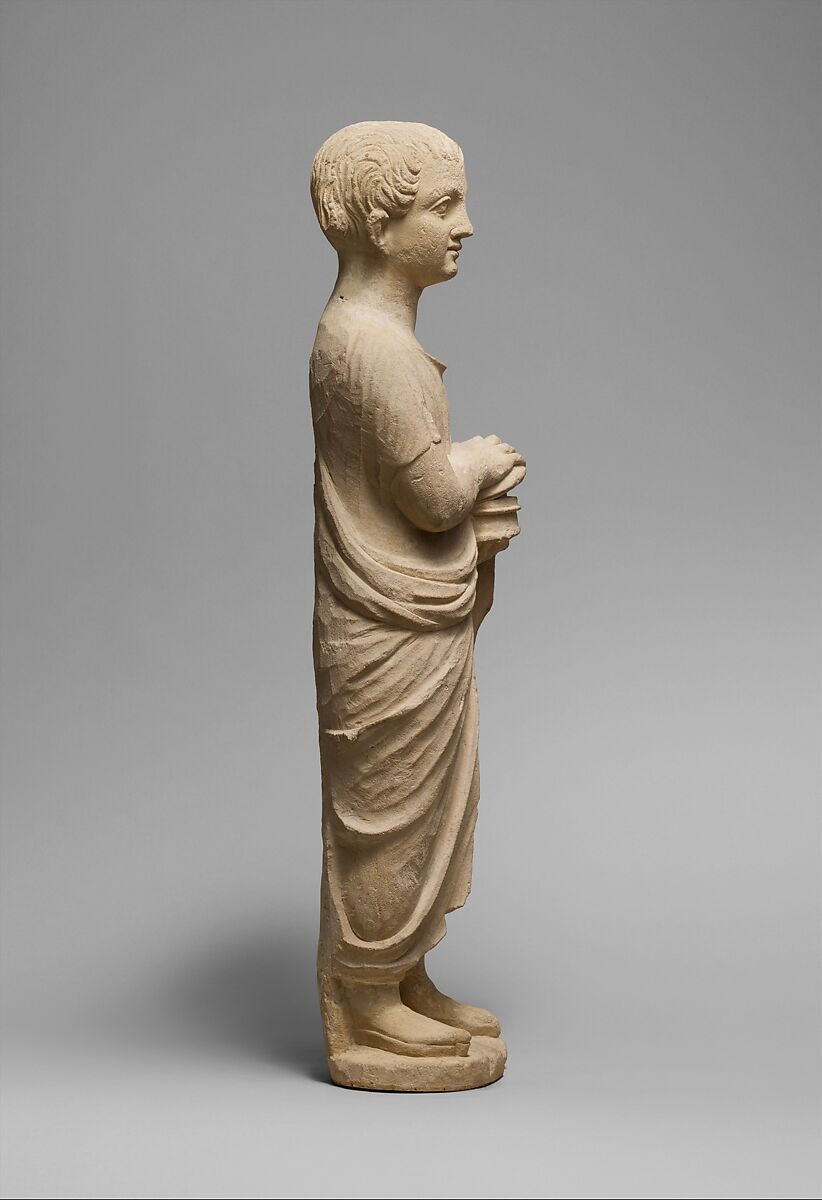 Limestone statue of a youth holding a pyxis, Limestone, Cypriot