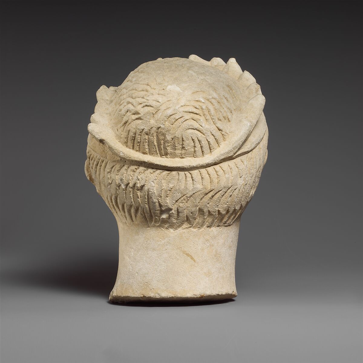 Limestone head of a wreathed youth, Limestone, Cypriot