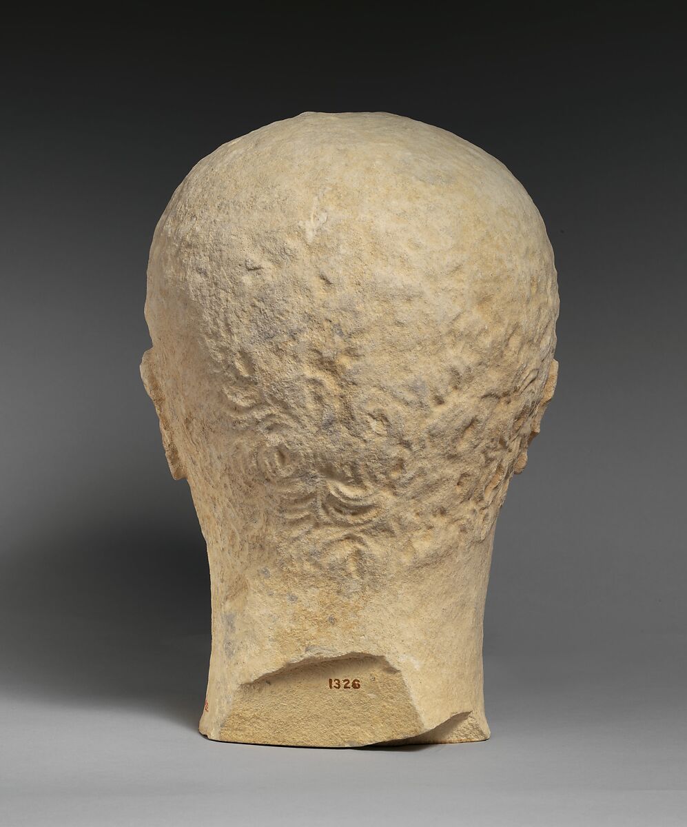 Limestone head of a beardless male votary, Limestone, Cypriot