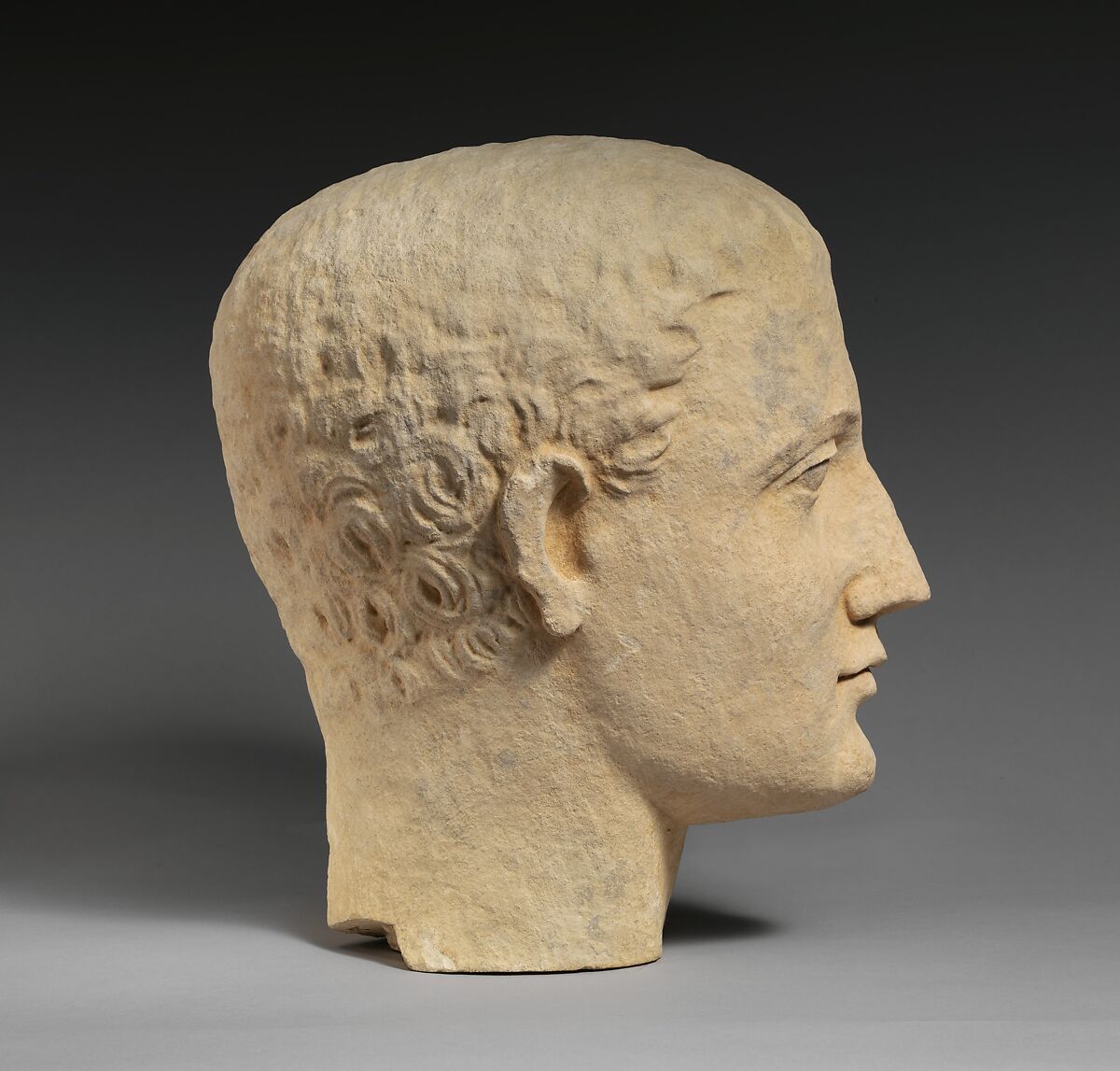 Limestone head of a beardless male votary, Limestone, Cypriot
