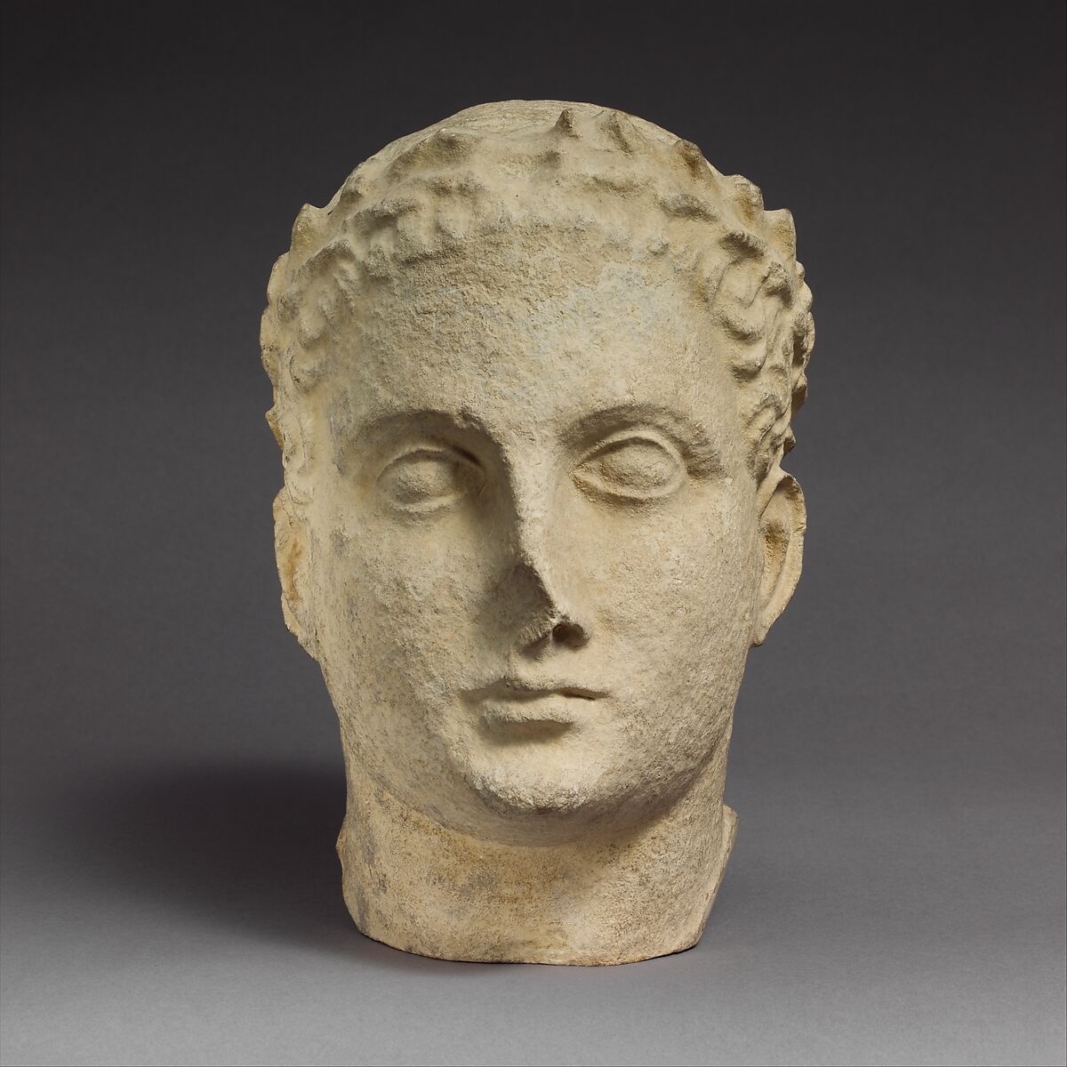 Limestone head of beardless male votary, Limestone, Cypriot 