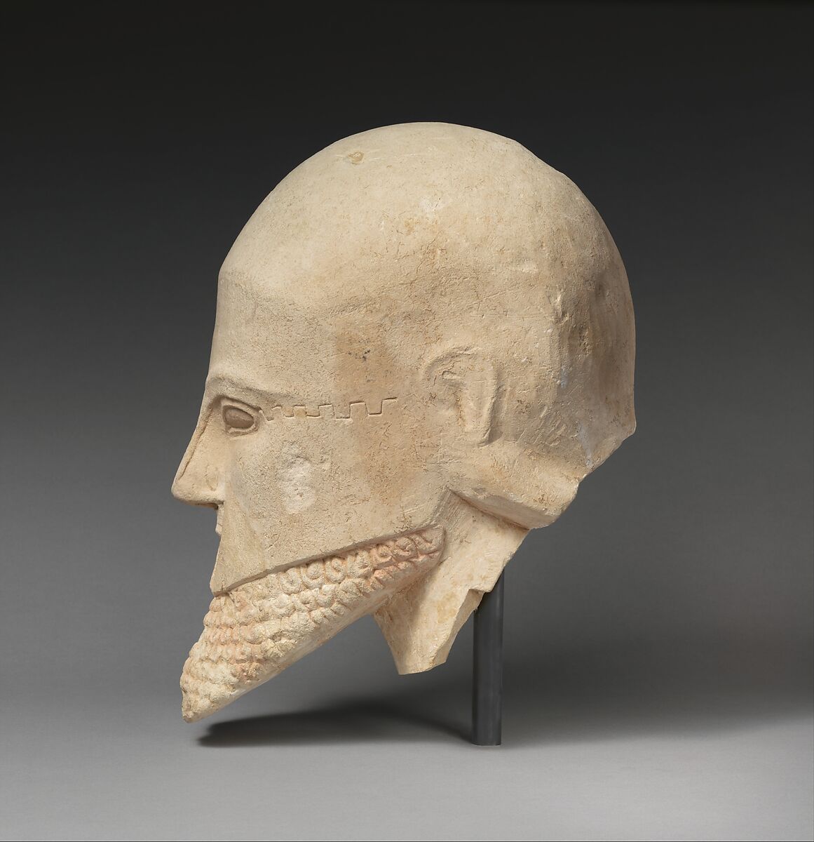 Limestone bearded head with a Corinthian helmet, Limestone, Cypriot