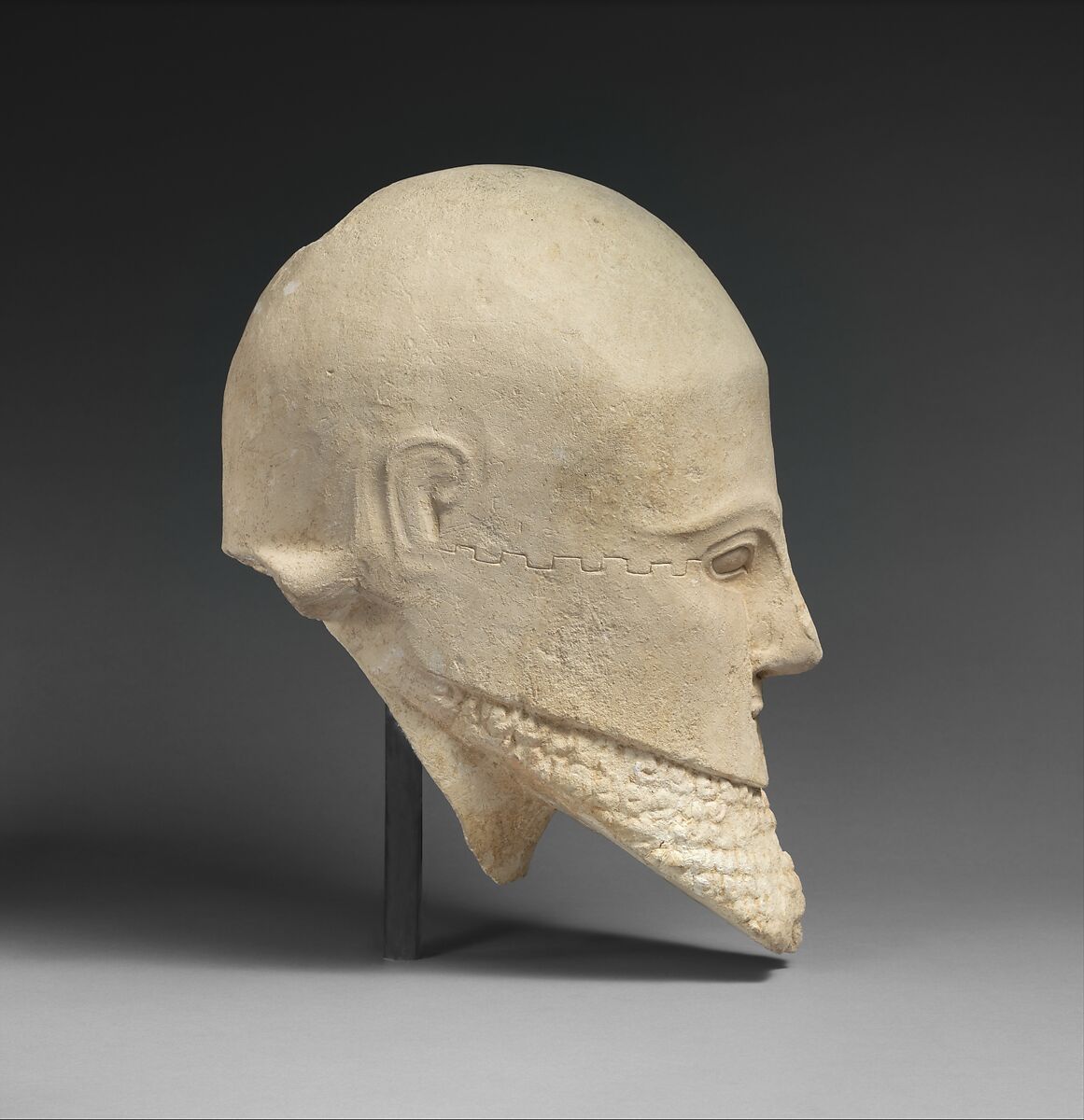 Limestone bearded head with a Corinthian helmet, Limestone, Cypriot