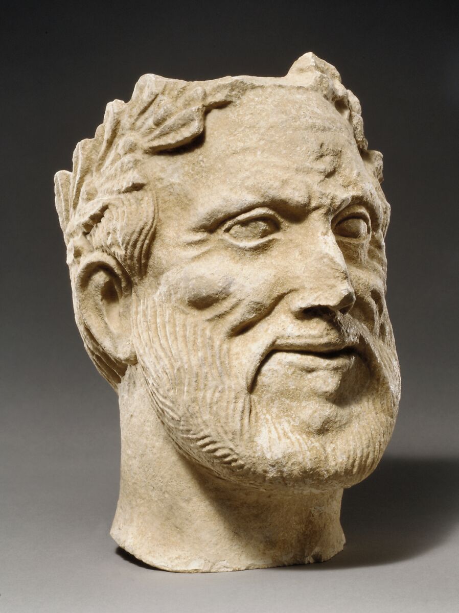 Limestone head of bearded male votary with wreath of leaves, Limestone, Cypriot
