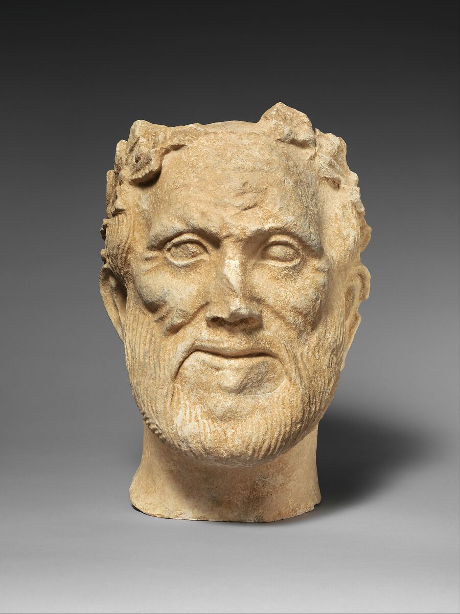 Limestone head of bearded male votary with wreath of leaves, Limestone, Cypriot 