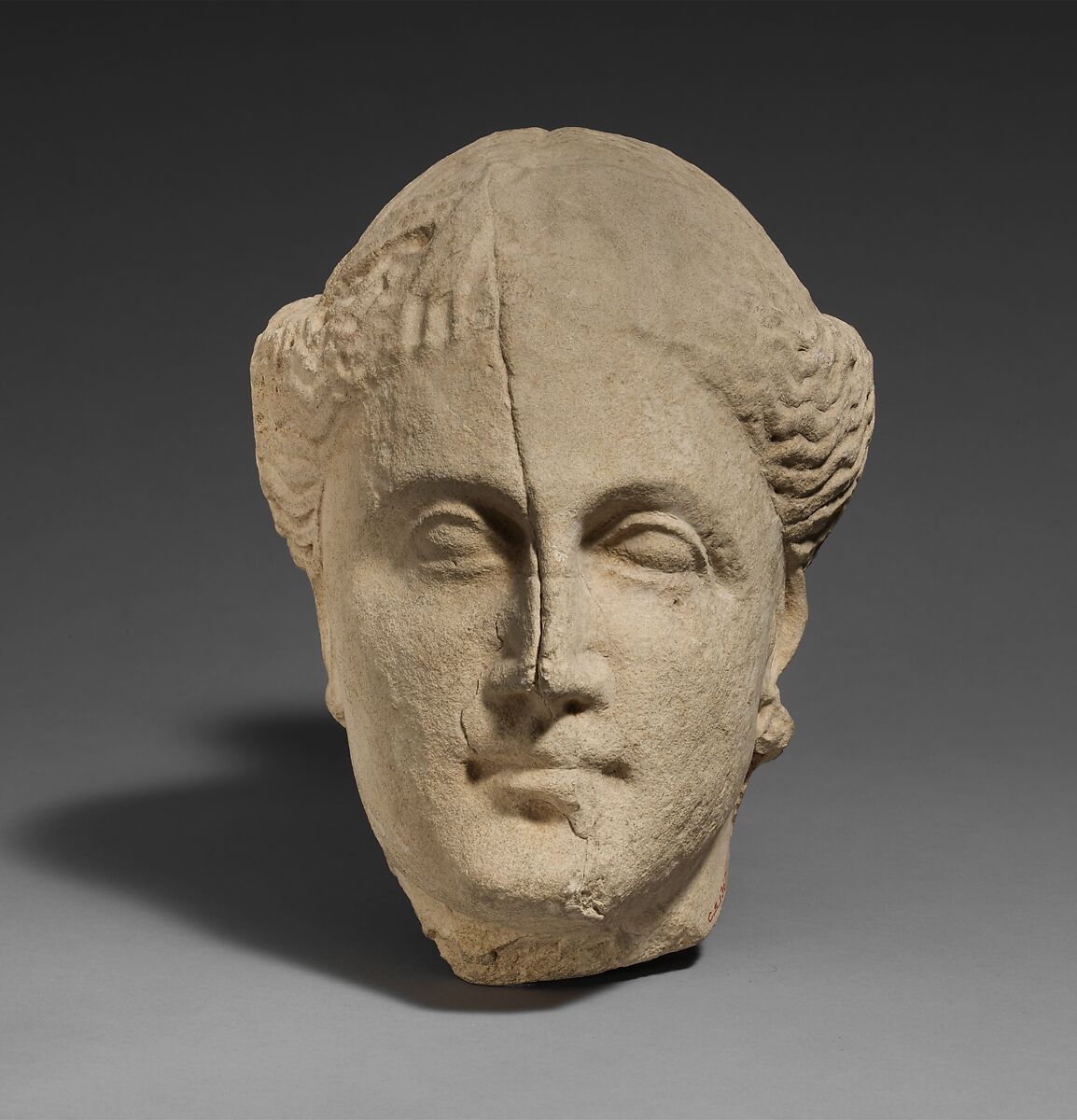 Limestone head of a female votary, Limestone, Cypriot 