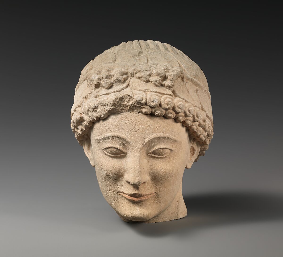 Limestone beardless male head with ivy wreath, Limestone, Cypriot 