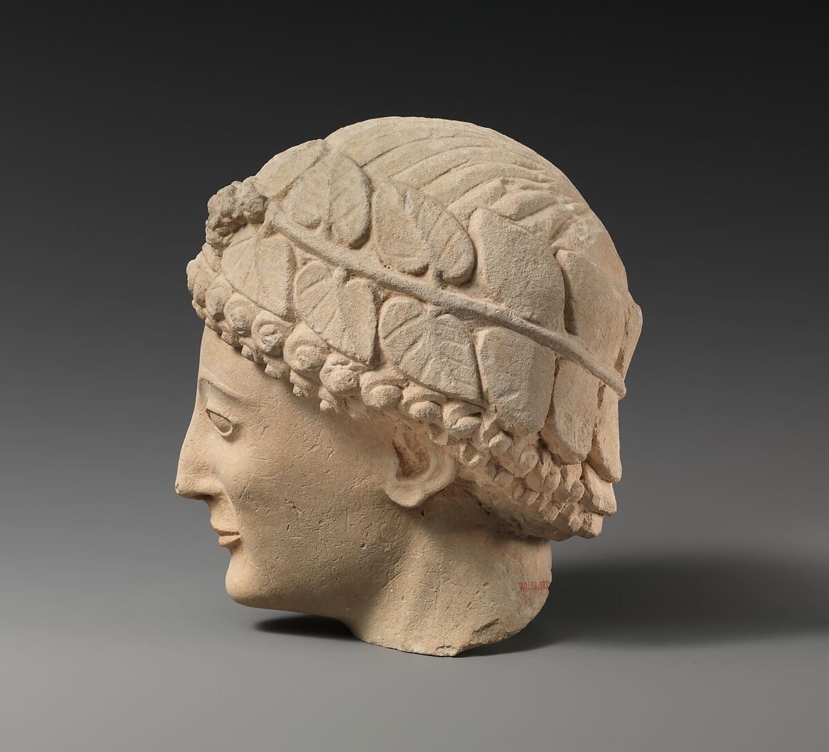 Limestone beardless male head with ivy wreath, Limestone, Cypriot