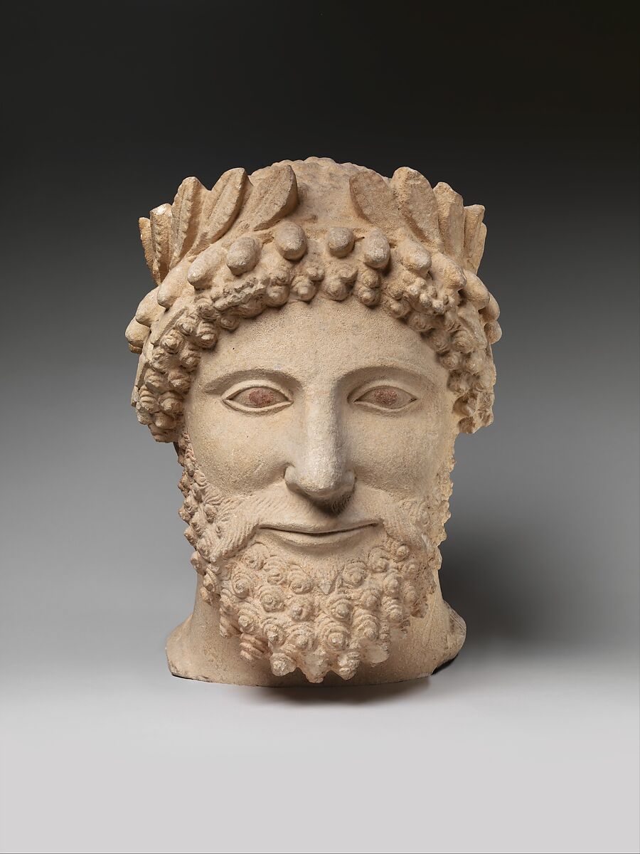 Limestone head of a bearded man wearing a wreath, Limestone, Cypriot 