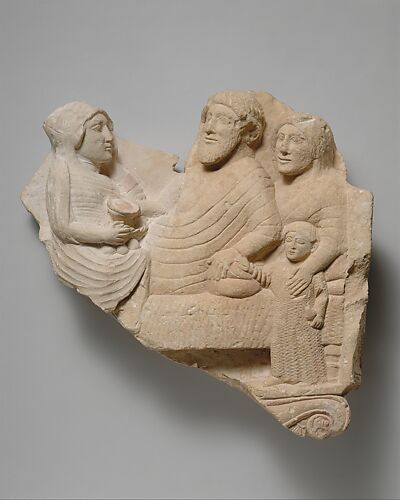 Fragment of a limestone grave relief with a banquet scene