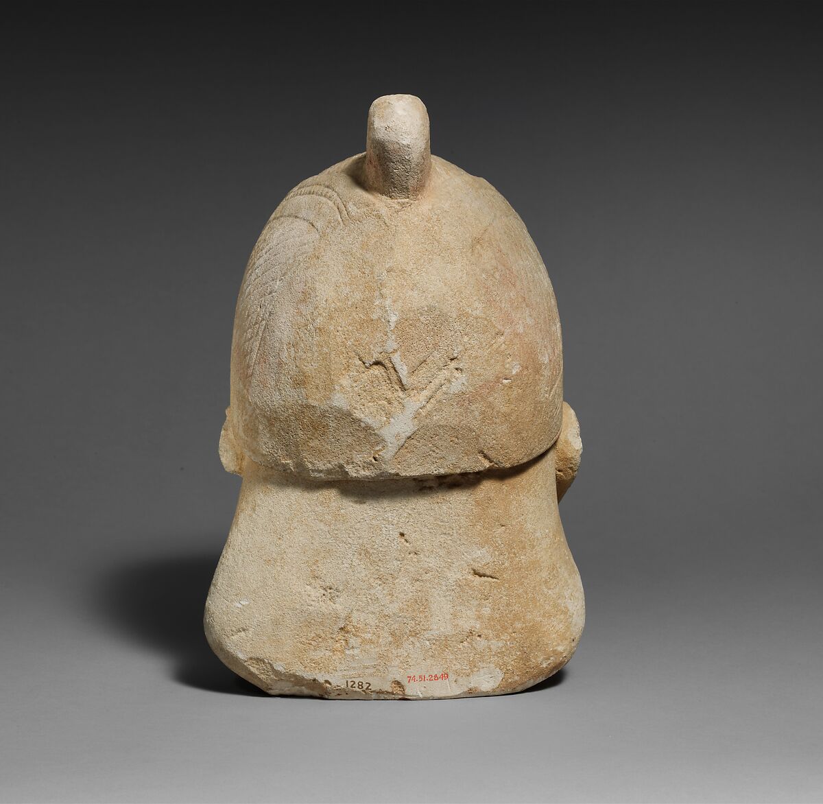 Limestone head of a bearded male wearing a conical helmet, Limestone, Cypriot