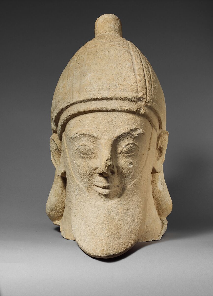 Limestone head of a bearded male wearing a conical helmet, Limestone, Cypriot