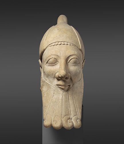 Limestone head of a bearded man