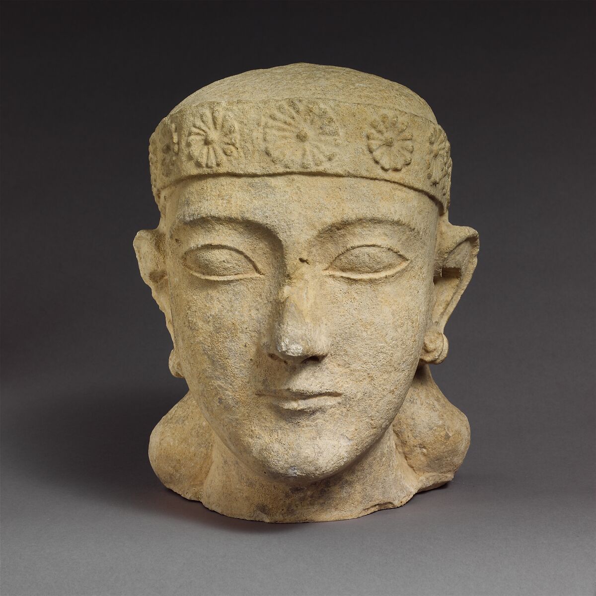 Limestone head of a beardless male with a diadem, Limestone, Cypriot 