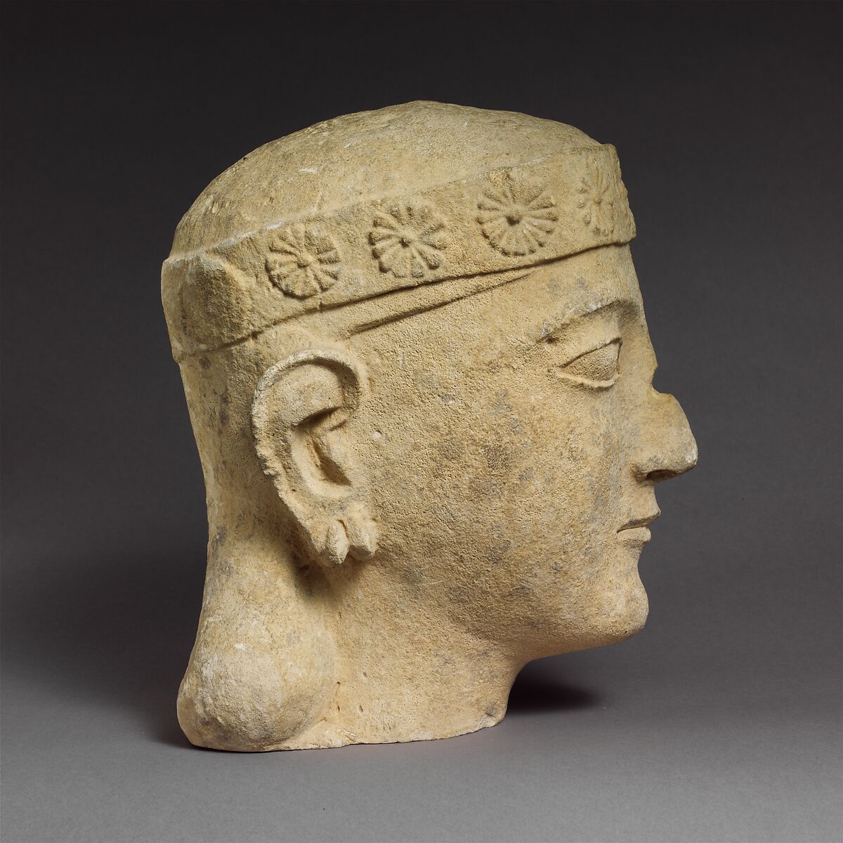 Limestone head of a beardless male with a diadem, Limestone, Cypriot