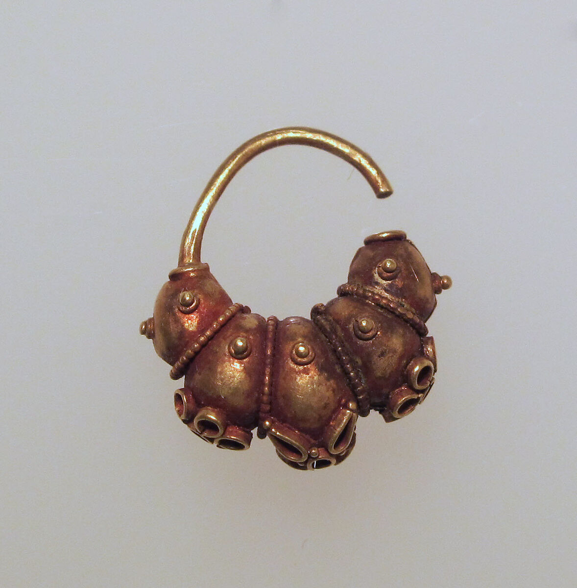Electrum earring with lobes and rosettes, Electrum, Cypriot 