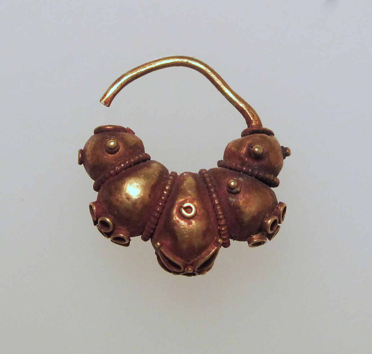 Electrum earring with lobes and rosettes, Electrum, Cypriot 