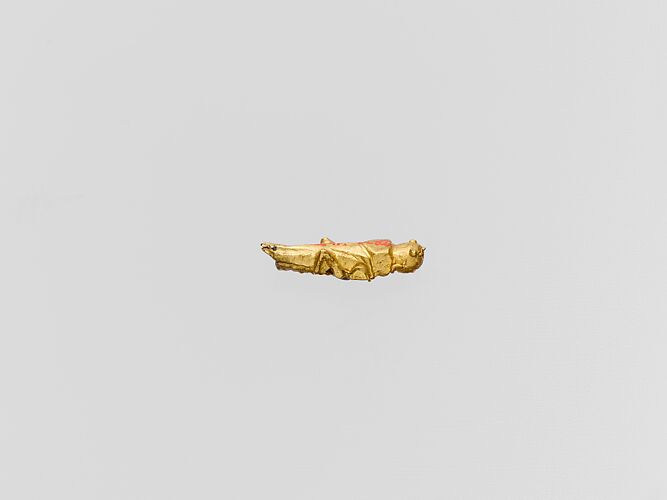 Gold capsule in the form of a grasshopper