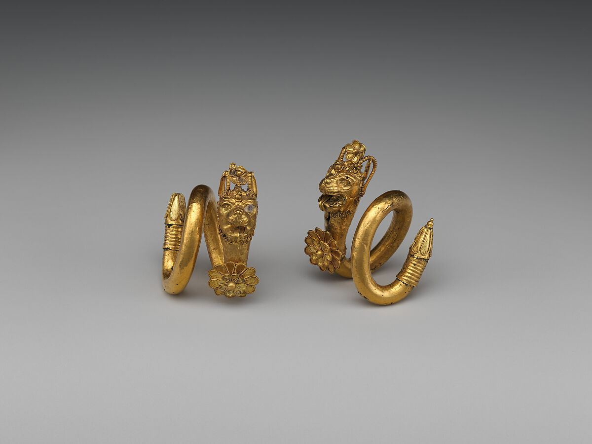 Gold and copper alloy spiral earring with lion-griffin head terminal, Gold, Greek, Cypriot 