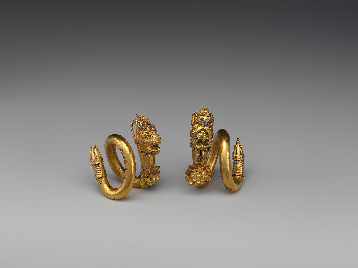 Gold and copper alloy spiral earring with lion-griffin head terminal, Gold, Greek, Cypriot
