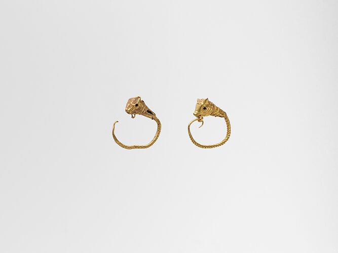 Gold earring with head of a bull