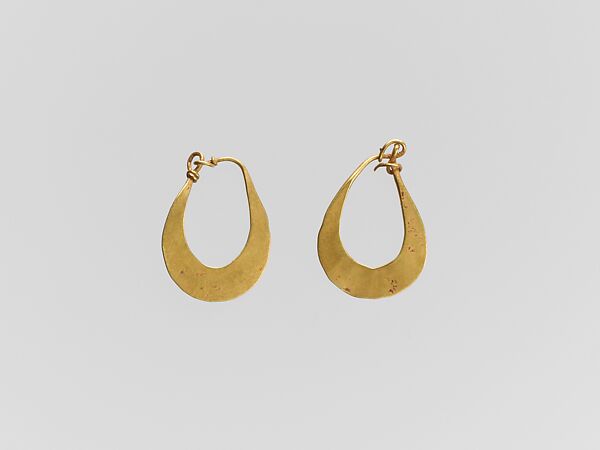 Gold crescent-shaped earring