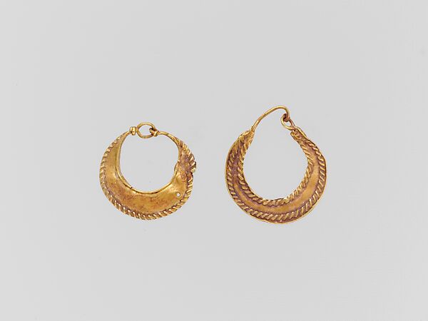 Gold crescent-shaped earring