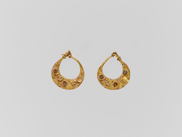 Gold crescent-shaped earring