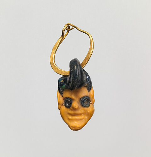 Gold earring with glass head pendant