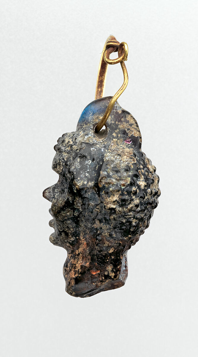 Gold earring with a glass pendant in the shape of a Black African’s head, Gold, glass, Greek, Eastern Mediterranean