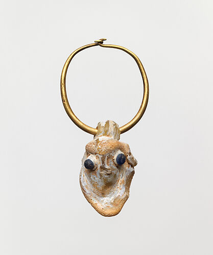 Gold earring with a glass pendant in the form of a demonic mask
