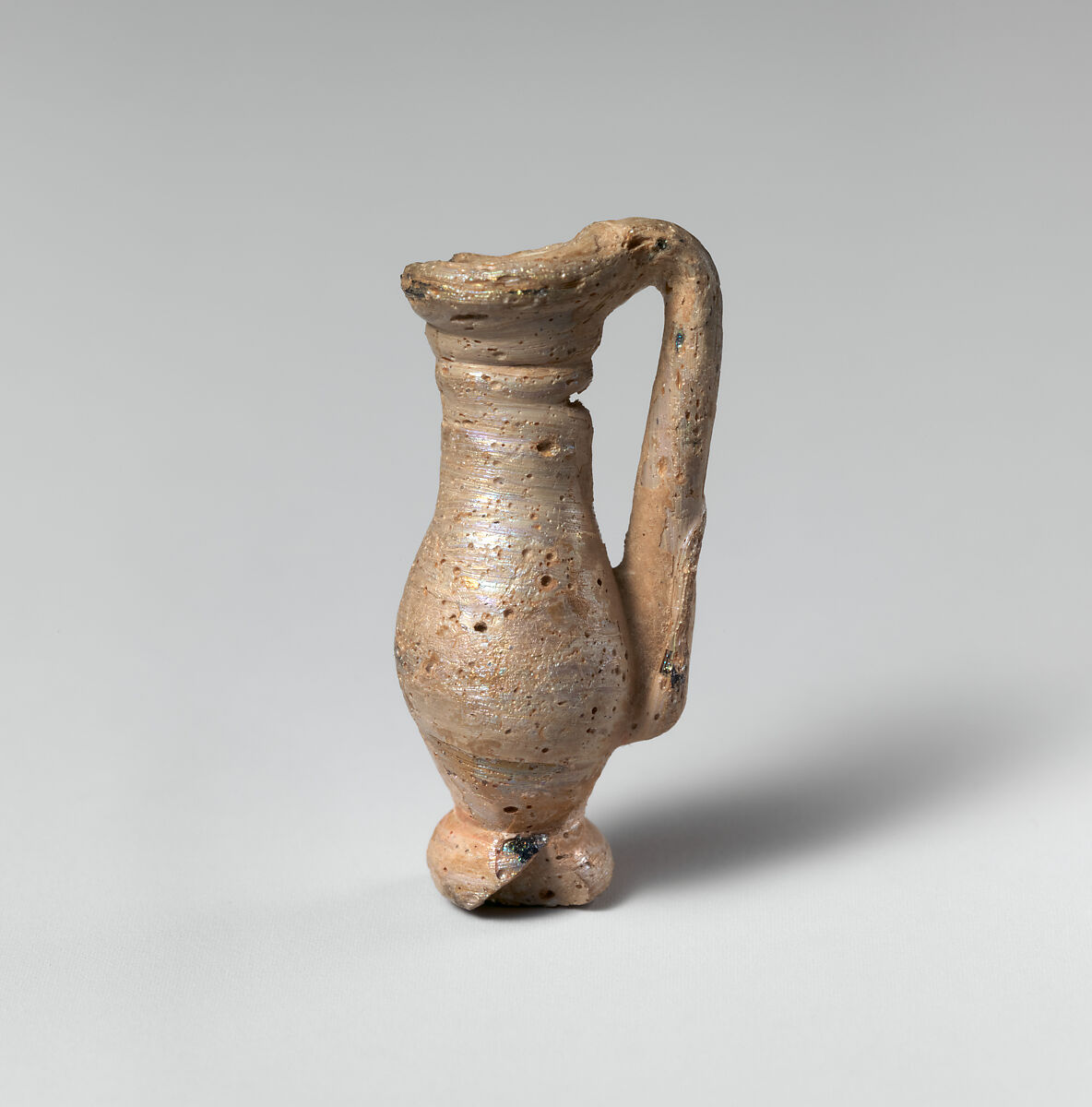 Glass pendant in the form of a miniature jug, Glass, Roman 