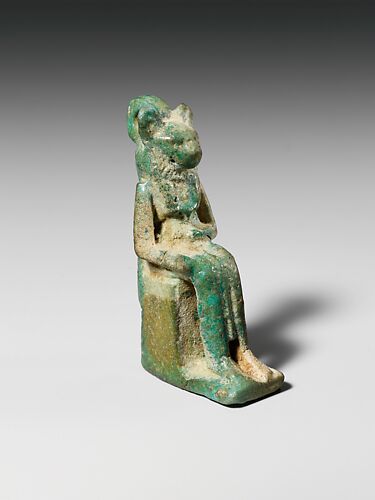 Faience amulet of a goddess with feline head