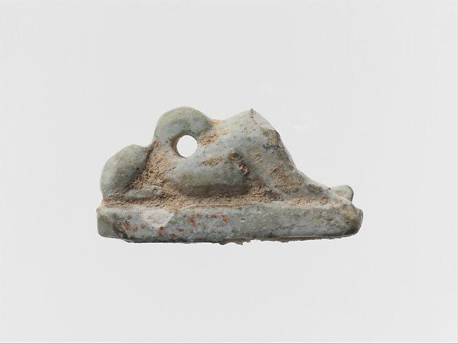 Faience amulet of a recumbent lion or sphinx