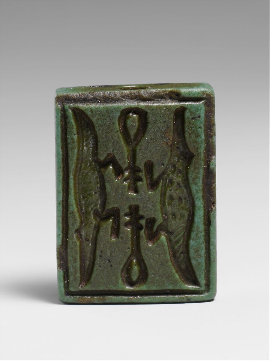 Faience amulet plaque of Isis nourishing a pharaoh, Faience, Egyptian