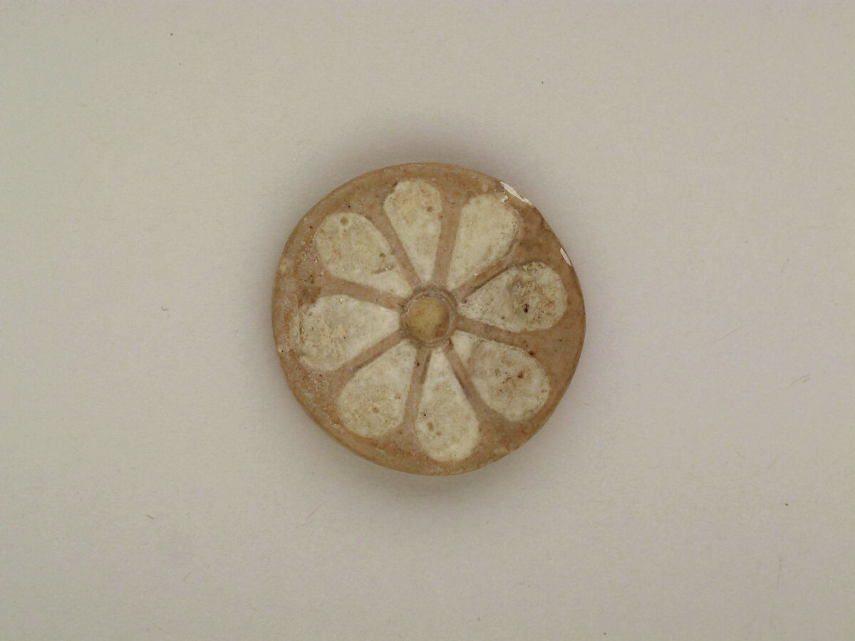 Roundels with daisy pattern, Clay, glazed