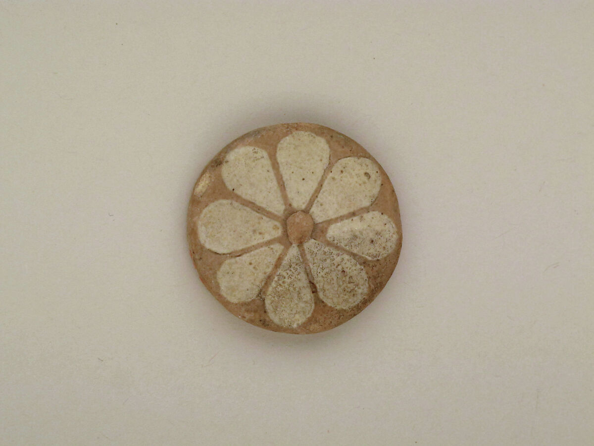 Roundels with daisy pattern, Clay, glazed
