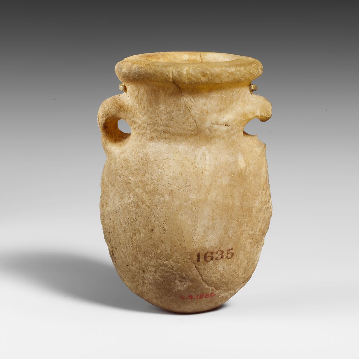 Miniature alabaster lentoid flask, Veined alabaster, Cypriot 