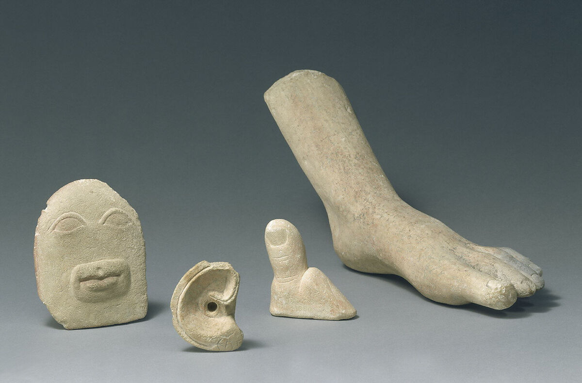 Limestone votive relief of eyes and a mouth, Limestone, Cypriot