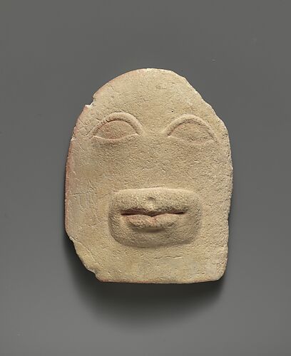 Limestone votive relief of eyes and a mouth