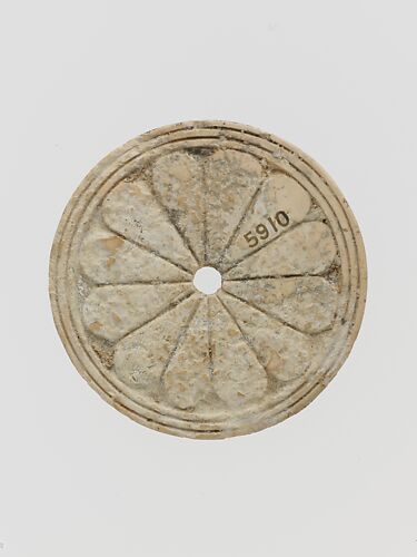 Ivory disk of a pyxis with rosette